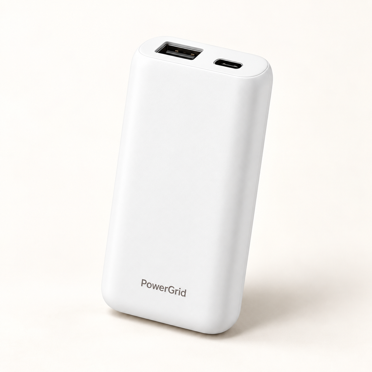 PowerGrid white power bank on a warm ivory studio background