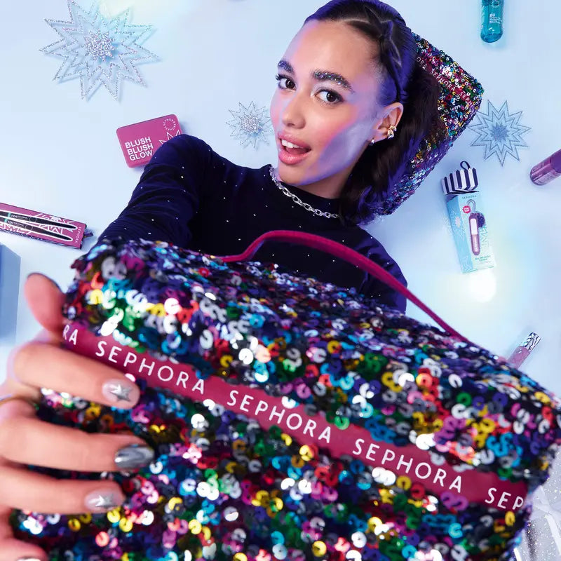 SEPHORA COLLECTION model presenting the premium sequined vanity case
